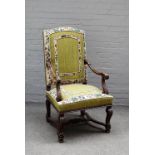 A 17th century Flemish style high back open arm chair on square cabriole supports united by X frame