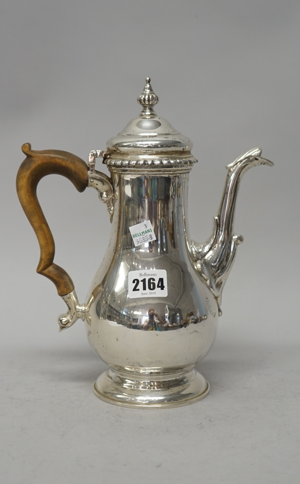 A silver coffee pot,