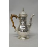 A silver coffee pot,