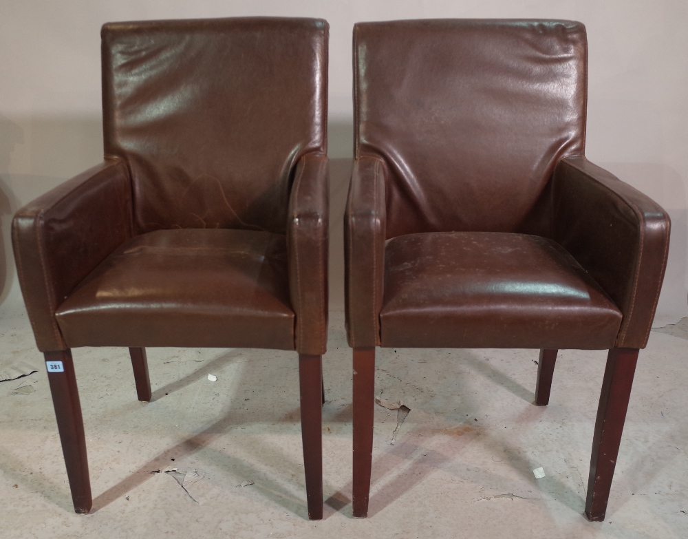 A set of six 20th century faux brown leather armchairs, on tapering supports, (6).