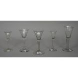 A group of five plain-stemmed wine glasses, mid 18th, various forms and sizes, (a.f), 15.5cm. to 19.
