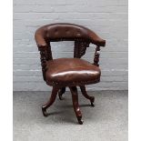 A Victorian mahogany framed tub back office swivel chair, on four downswept supports,