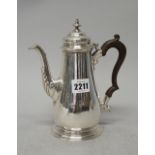 A late George II silver small coffee pot,