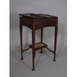 An unusual Edwardian mahogany fold out bijouterie table, (a.f).