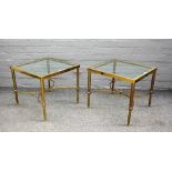 A pair of 20th century lacquered brass square occasional tables with inset glass tops on reeded