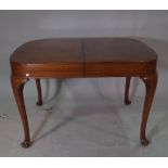 Waring & Gillow a mid-20th century walnut extending D-End dining table, with one integral leaf,