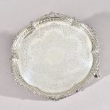 A Victorian silver salver, of shaped circular form, having a leaf capped gadrooned border,