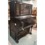 A 19th century, black painted Barrel organ with winding handle and internal drum