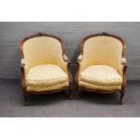 A pair of Louis XV style beech framed tub back armchairs, on scroll feet, 70cm wide x 85cm high.