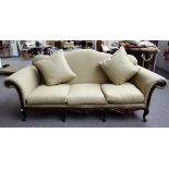 Ralph Lauren; a Louis XV style hump back sofa with carved hardwood frieze on scroll supports,