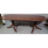 A Regency style mahogany D-end extending dining table on six downswept supports with one extra leaf,