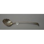 An early George III bottom marked silver soup ladle, in the onslow pattern, with shell bowl,