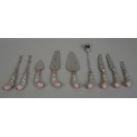 A part suite of cutlery with German porcelain handles comprising; seven knives, seven forks,