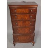 A 20th century mahogany bowfront narrow chest, with five long graduated drawers,