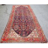 A Fereghan runner, Persian, the dark indigo field with an all over herate design,