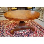 A George IV mahogany centre table, the circular snap top on three inswept supports,