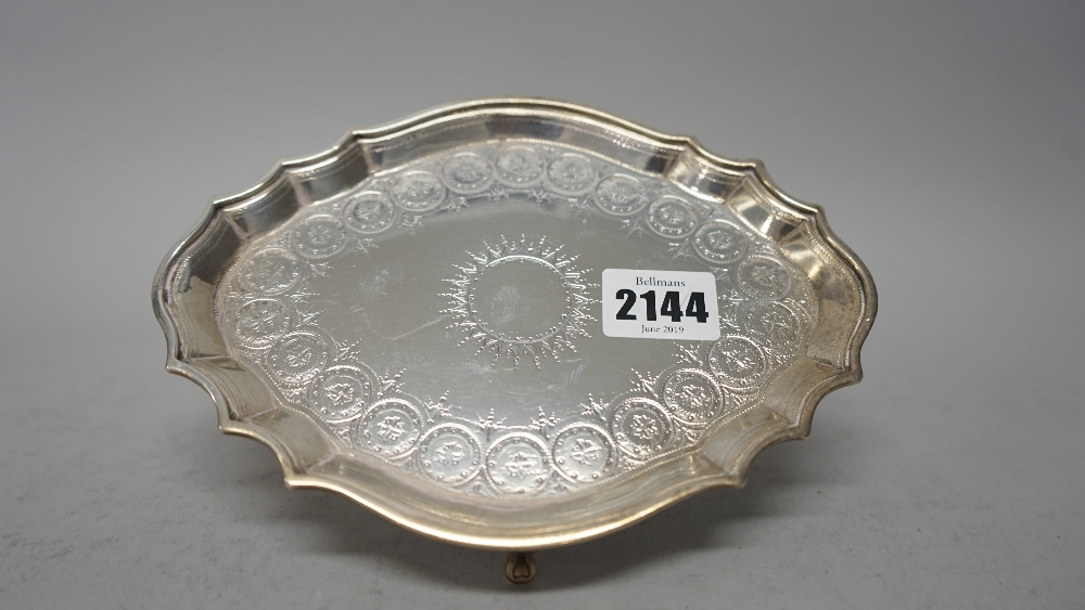 A George III silver teapot stand, of shaped oval form, with bright cut engraved decoration, - Image 3 of 7