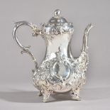 A Victorian silver coffee pot, of baluster form, the hinged lid with a melon form finial,