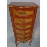A Regency style hardwood serpentine tall chest, with six short drawers on cabriole supports,