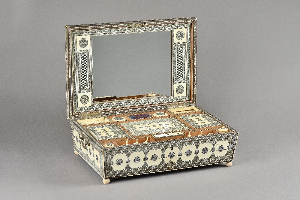 An early 19th century Sadeli ware sewing box of sarcophagus form,