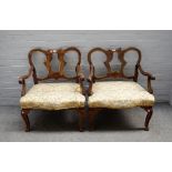 A pair of mid-18th century Italian walnut and parcel- gilt open armchairs, probably Tuscany,
