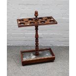 A Victorian stained beech umbrella stand, on ring turned baluster support and rectangular base,