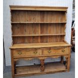 An early 19th century pine dresser,