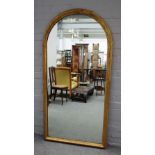 A Victorian style arched giltwood mirror, 83cms wide, 164cms high.