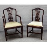 A set of seven George III style mahogany dining chairs with pierced splat on tapering square