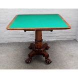 A Regency rosewood 'D' shaped card table on turned column and paw feet, 91cm wide x 74cm high.