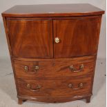 A George III mahogany bowfront commode/side table, with lift top over two dummy drawers,