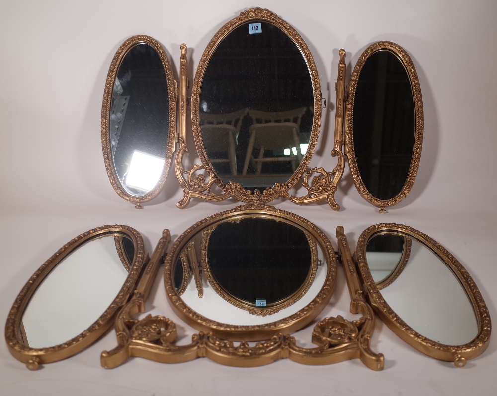 A pair of 20th century gold painted triptych dressing table mirrors, 35cm wide x 52cm high, (2).