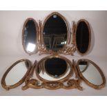 A pair of 20th century gold painted triptych dressing table mirrors, 35cm wide x 52cm high, (2).