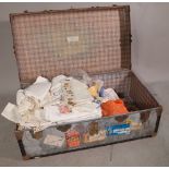 A travel trunk, 90cm wide x 37cm high containing mainly 20th century fabric.