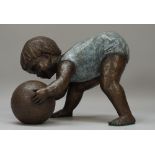 Owen; a modern patinated bronze of a toddler playing with a ball,