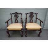 A pair of 18th century style mahogany framed open armchairs with pierced splat back on acanthus