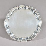 A George II silver card tray, of shaped circular form,