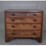 An early 19th century mahogany and ebony strong chest of four long graduated drawers on bracket