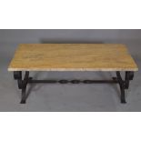 A 20th century wrought iron rectangular table, with yellow marble top, 121cm wide x 45cm high.