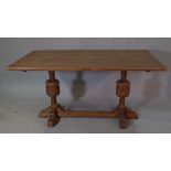 An 18th century style oak refectory table, on bulbous turned supports,