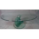 A 20th century oval glass coffee table, 120cm wide x 66cm diameter.