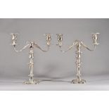 A pair of silver three light table candelabra,