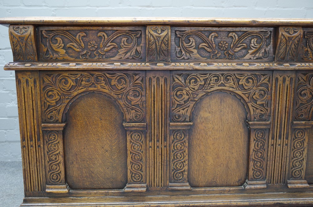 A 17th century style oak coffer, with triple panel lid and front, on stile feet, - Image 3 of 5