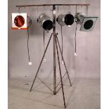 A 20th century four branch aluminium studio light on tripod base, 185cm tall.