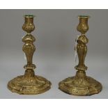 A pair of French gilt patinated brass candlesticks, late 19th century,