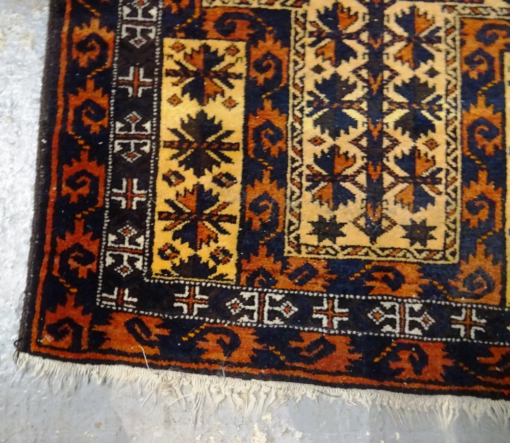 An Afghan rug, 184cm x 113cm and two Beluchi rugs, 136cm x 77cm, 175cm x 92cm, (3). - Image 6 of 9