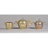 A late 19th century Continental silver gilt three piece tea set, import marks for London, 1888,