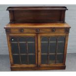 A William IV rosewood chiffonier, the ledge back over drawer and pair of cupboards,