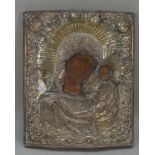 An 18th century Russian Icon with silver oklad, depicting Madonna and child, impressed marks,