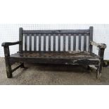 A 20th century brown painted hardwood garden bench, 150cm wide.